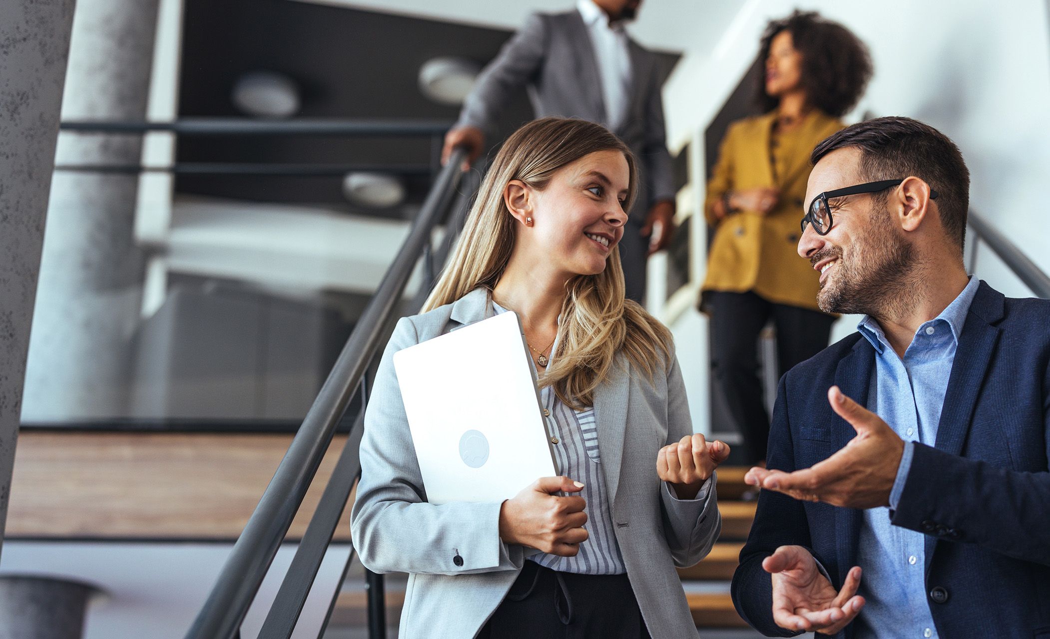 Group of people walking down stairs