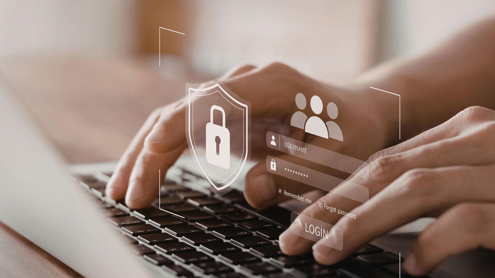 Hände tippen auf Laptop-Tastatur mit eingeblendeten Symbolen für Benutzerauthentifizierung und Sicherheit