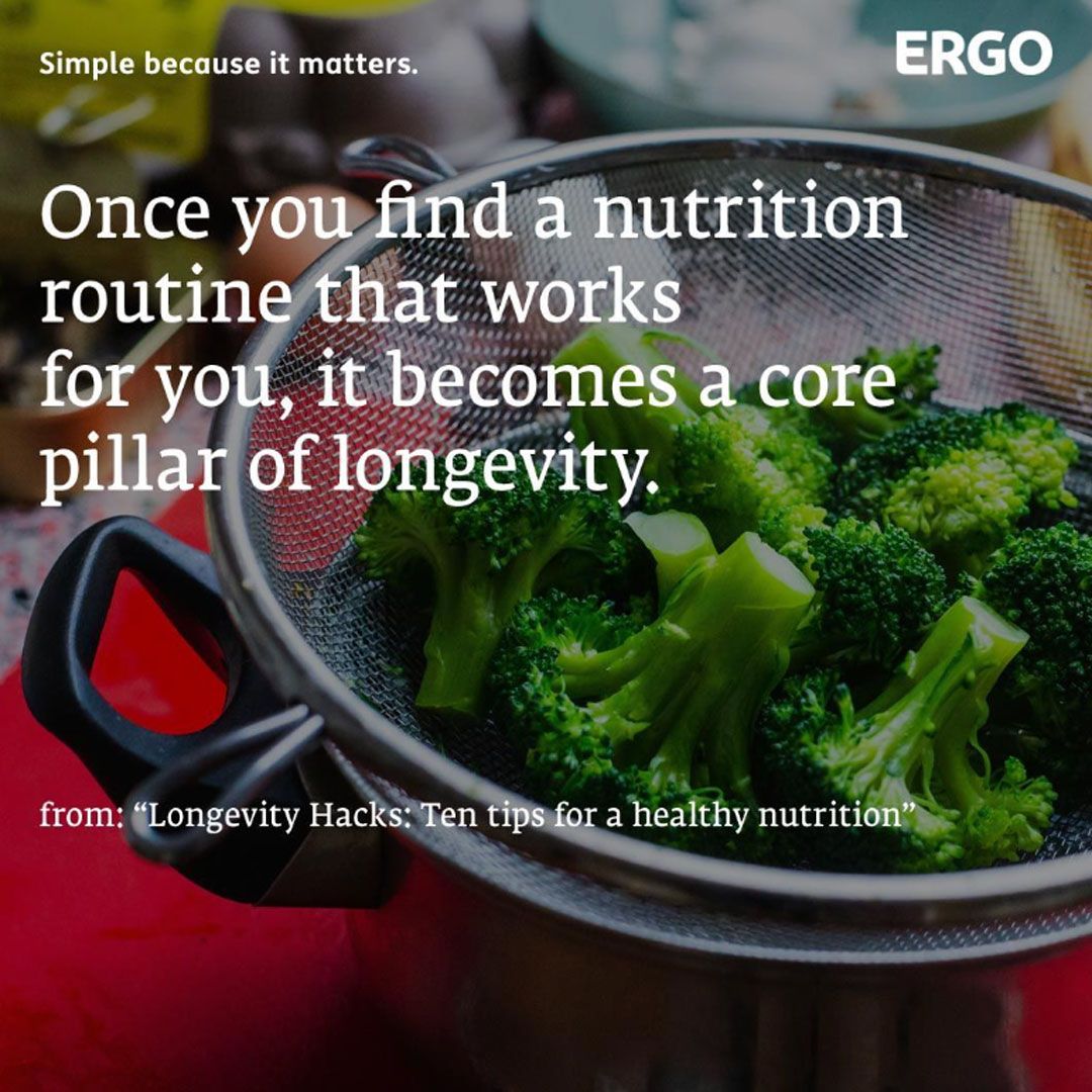 Broccoli in a sieve over a pot on a kitchen worktop.