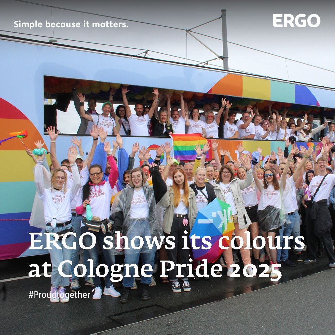 Many people in and on a colourful float at Pride parade in Cologne