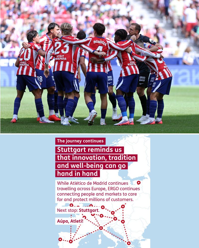 Footballers from Atlético de Madrid are standing in a circle on the pitch, discussing their tactics for the match.  