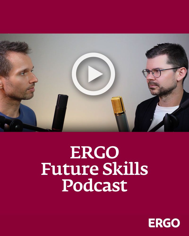 Two men, each standing in front of a microphone.