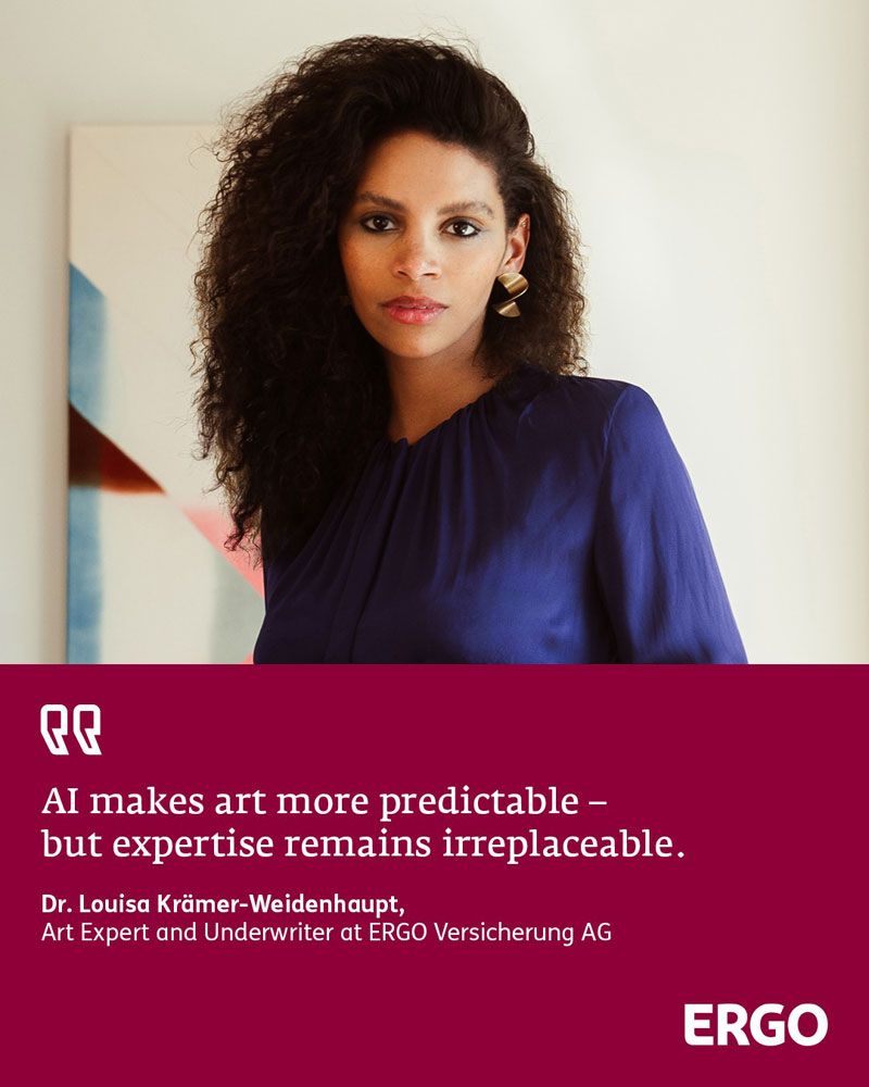 Young black woman wearing a purple blouse against a light-coloured background
